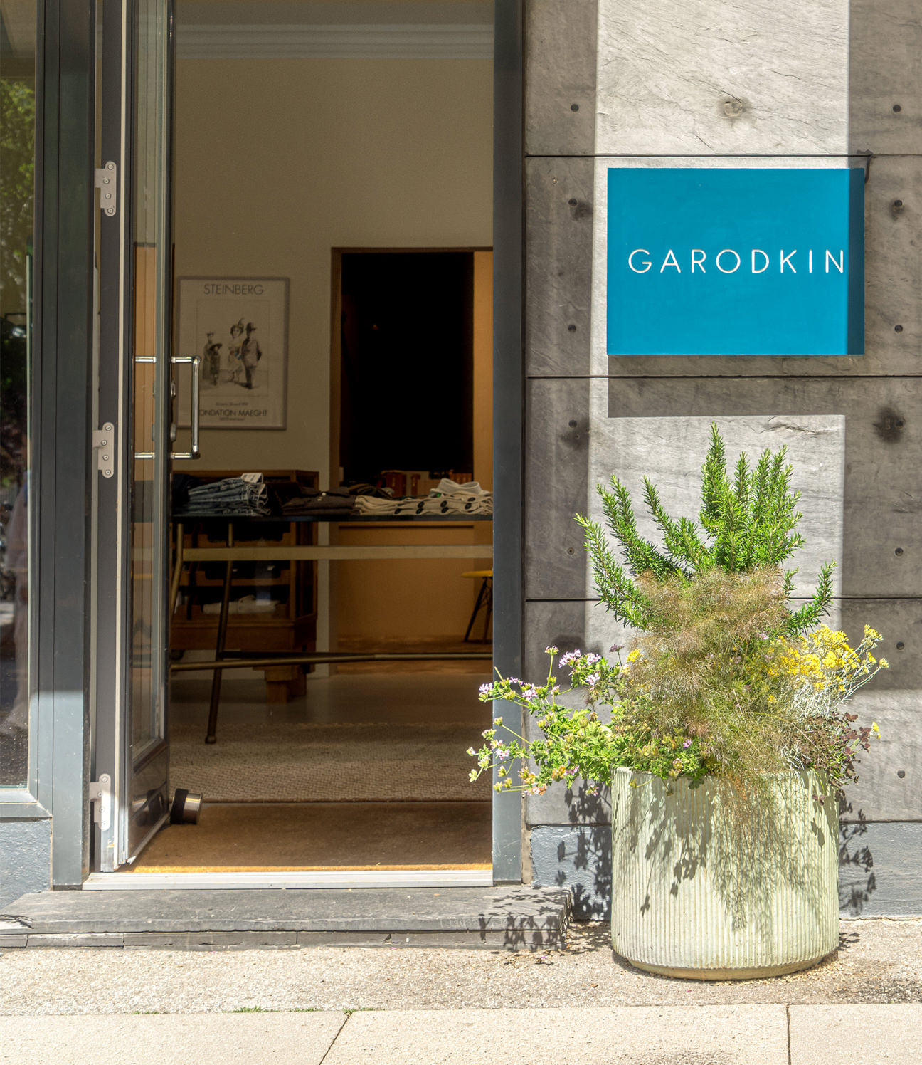 Garodkin storefront with sign and plants