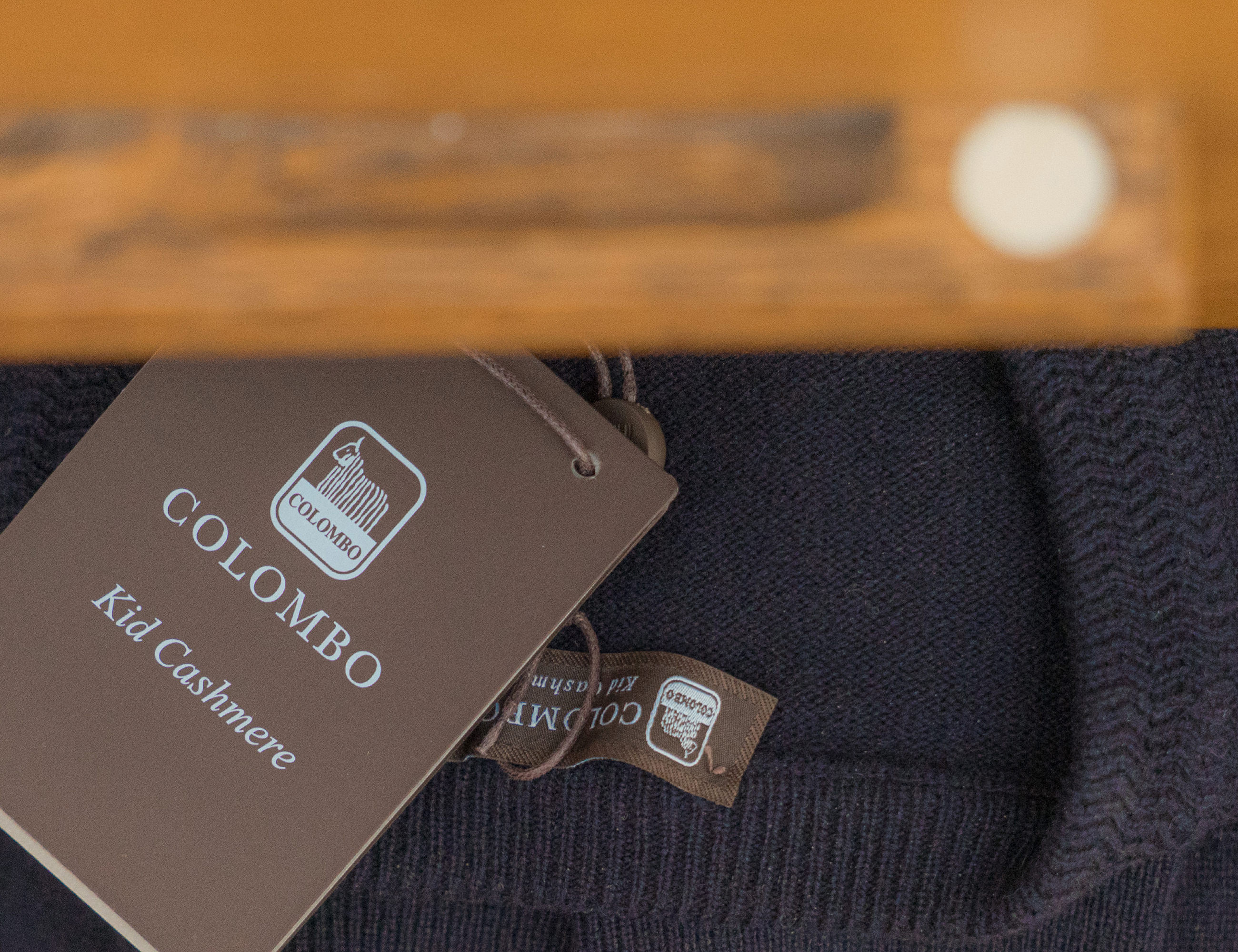 Colombo garment tag on a navy knit from Garodkin